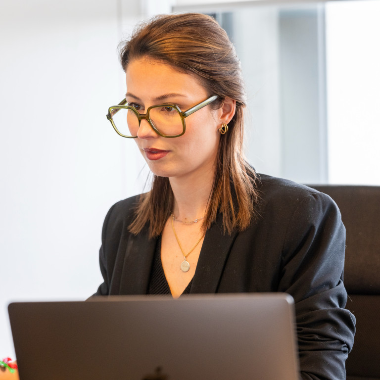 Colleague working in front of computer